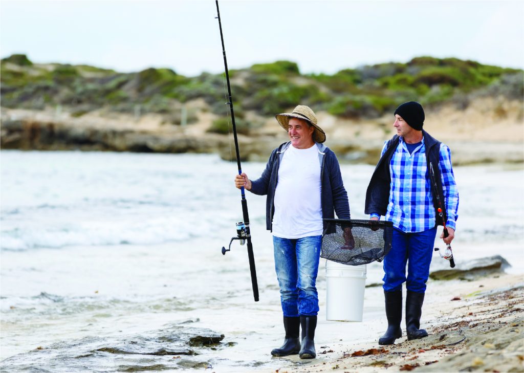 two fisherman in the beach